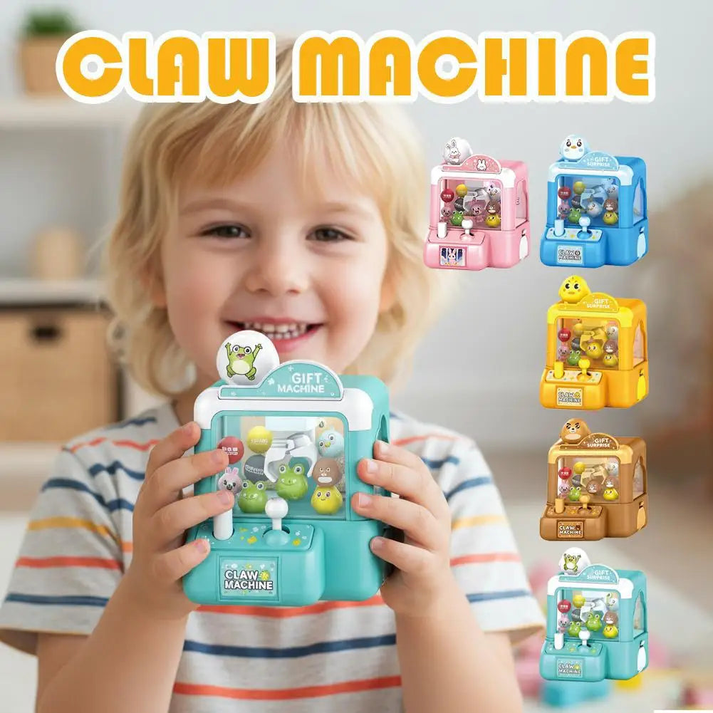 A young child holds a green claw machine toy, demonstrating the portable arcade game for kids.