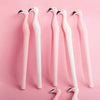 Three pink and white flamingo-shaped diamond painting tools displayed against a pink background.