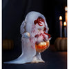 A translucent white plush doll pendant with a sheer veil and red hair resting on an orange pumpkin.