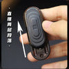 A hand holds a black EDC push slider fidget toy with concentric ridges, demonstrating its use for stress relief.