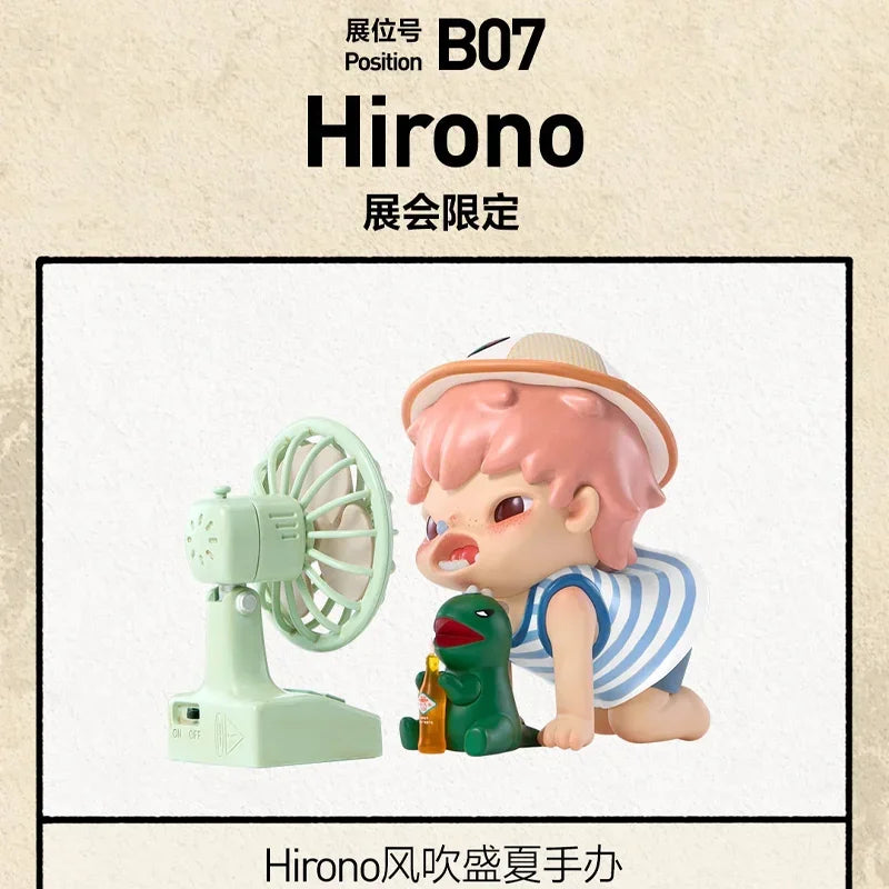 Hirono figure with pink hair and a green accessory, next to a vintage-style electric fan.
