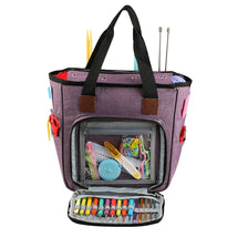 A purple canvas tote bag with multiple pockets for storing knitting supplies and yarn.