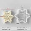 A white silicone mold shaped like a snowflake, showing its dimensions and weight.