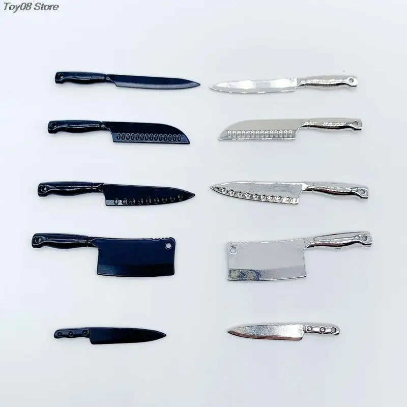 A collection of miniature metal kitchen knives in various sizes and finishes for a dollhouse