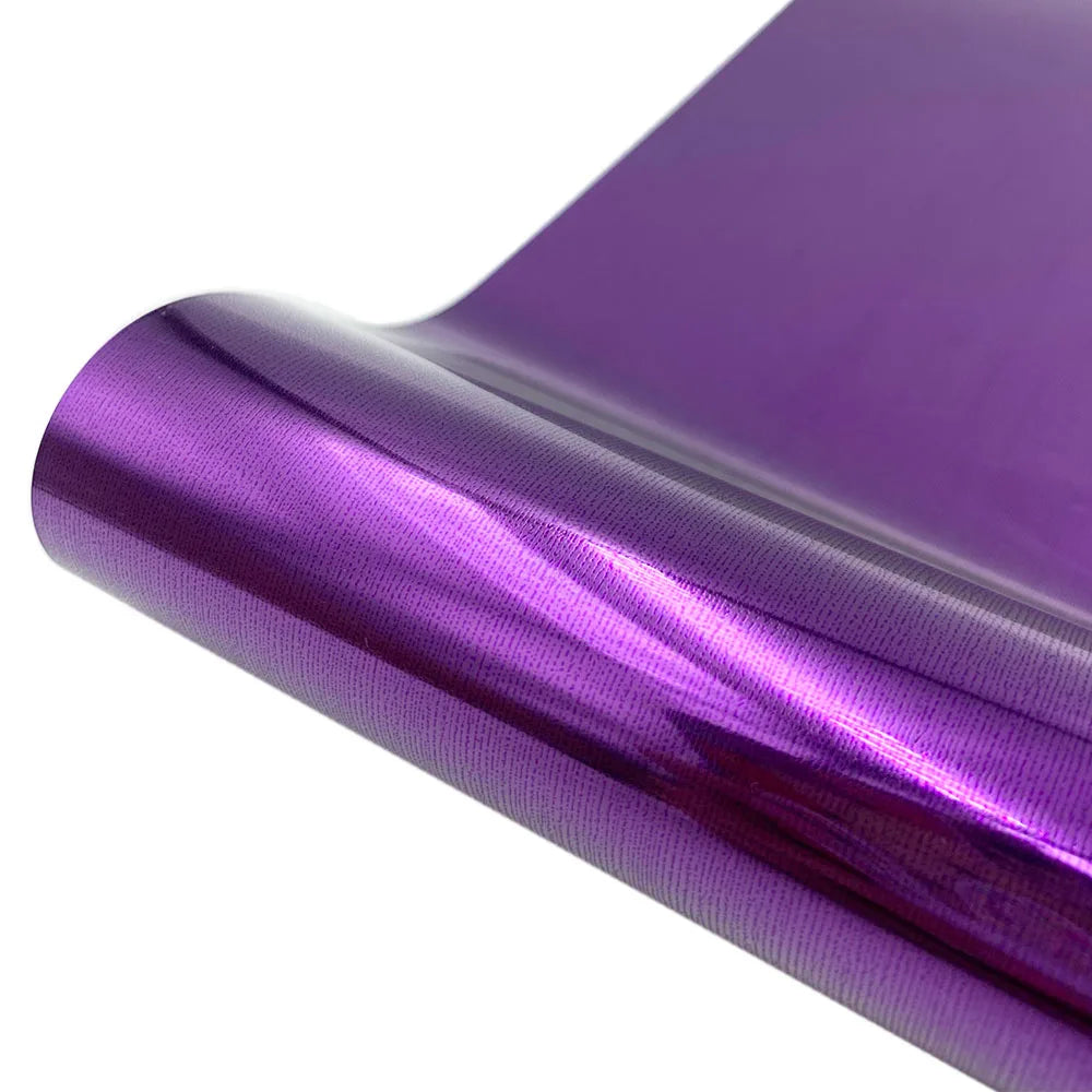 Purple holographic vinyl roll showing a smooth, reflective surface.