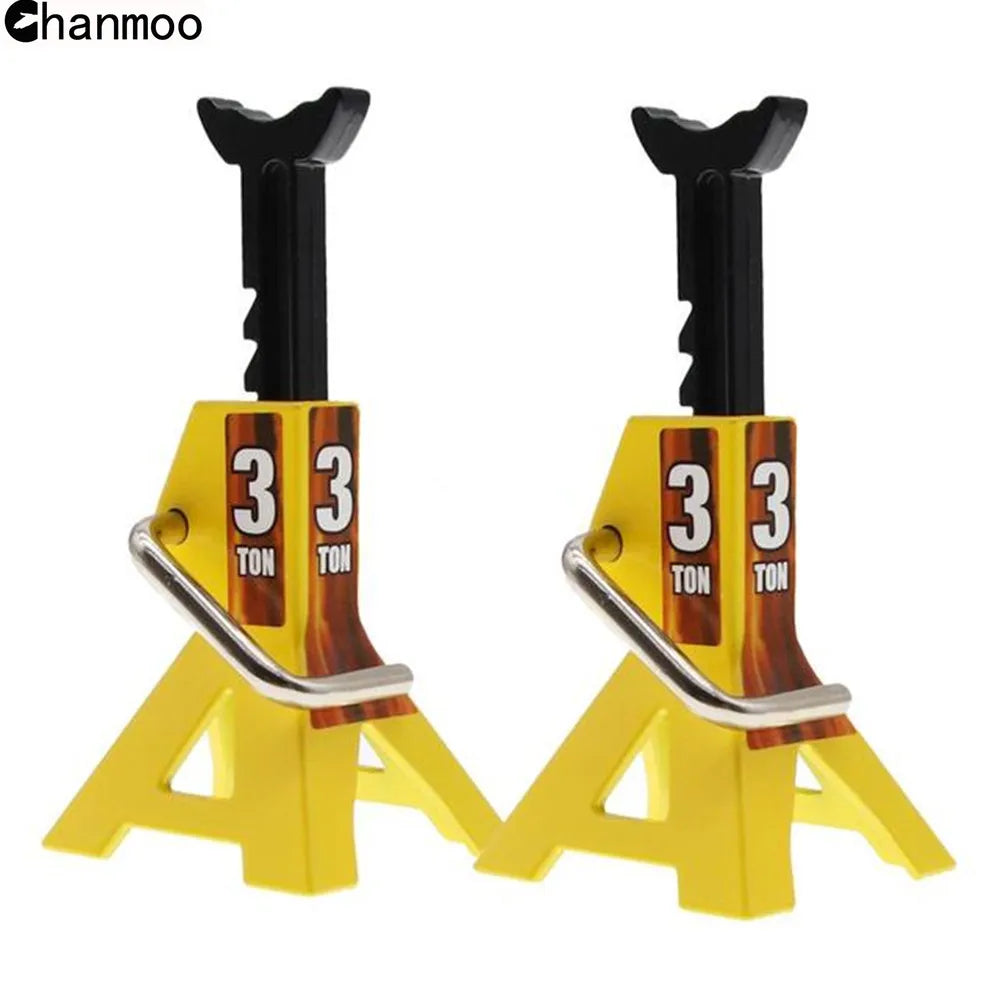A pair of yellow metal simulation jack stands for 1:10 RC crawlers