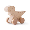 A wooden dinosaur toy car designed as a teether, made of light-colored wood.