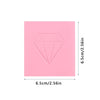 A square block of pink diamond painting clay with a diamond shape molded into the surface.