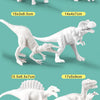 White plastic dinosaur figures in various sizes and poses shown against a teal background.