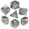 A set of seven marble effect polyhedral dice in various colors and angles.