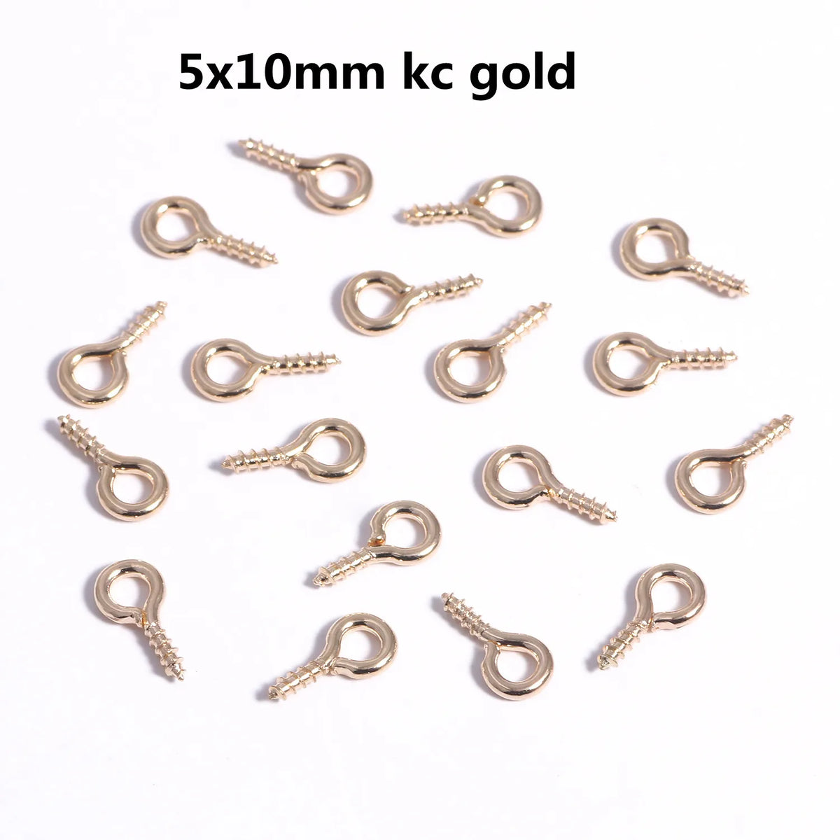 A collection of 5x10mm gold eye pins with screw threads for jewelry making.