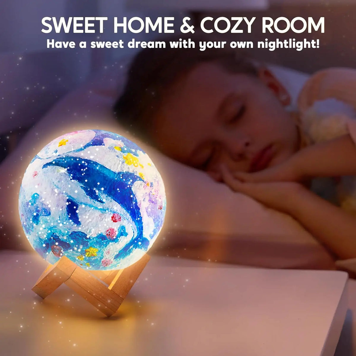 A glowing blue and white spherical night light resembling the moon is resting on a wooden base.