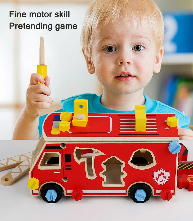 A toddler plays with a red wooden toy car and tools, including a screwdriver and wrench.