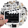 A collection of minimalist black and white stickers, including film strip icons, cameras, and various graphic elements.