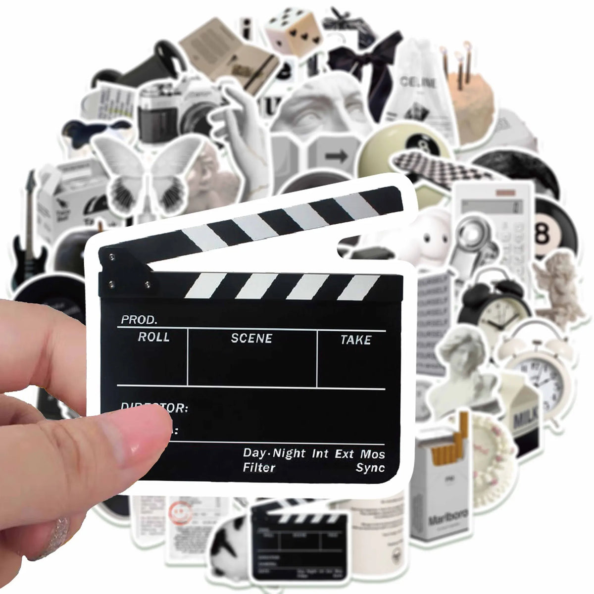 A collection of minimalist black and white stickers, including film strip icons, cameras, and various graphic elements.