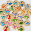 A collection of wooden dinosaur and traffic themed memory matching game pieces.