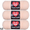 Three skeins of Super Soft Yarn in a light peach color packaged with labels
