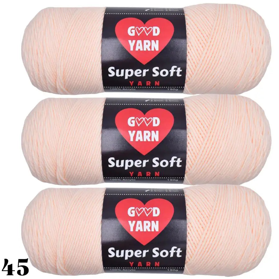 Three skeins of Super Soft Yarn in a light peach color packaged with labels