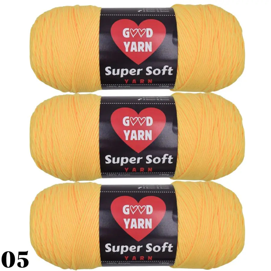 Three skeins of Super Soft Yarn in a bright yellow color for crochet and knitting