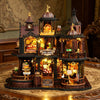 A detailed wooden miniature castle dollhouse kit featuring architecture, furniture, and illuminated elements.