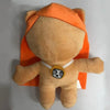 An orange plush doll resembling a bear or animal, with an orange ear covering.
