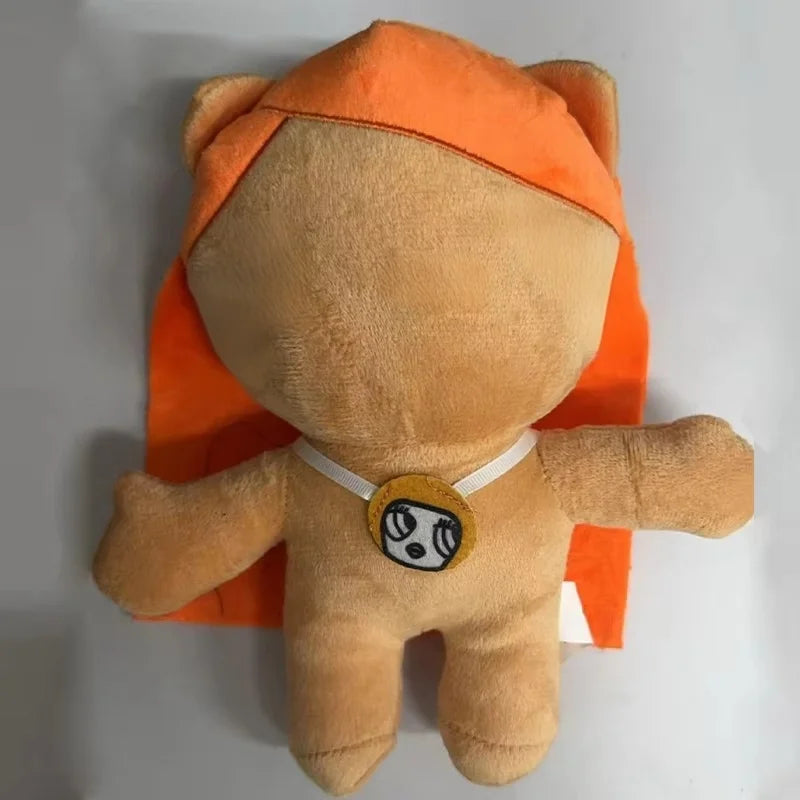 An orange plush doll resembling a bear or animal, with an orange ear covering.