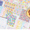 A collection of colorful mini deco cut film stickers in various patterns and colors arranged on white paper.