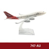 Diecast model of a Qantas Boeing airplane in white and red livery.
