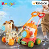 A child is playing with a bright orange and yellow bubble machine toy featuring lights and stable wheels.