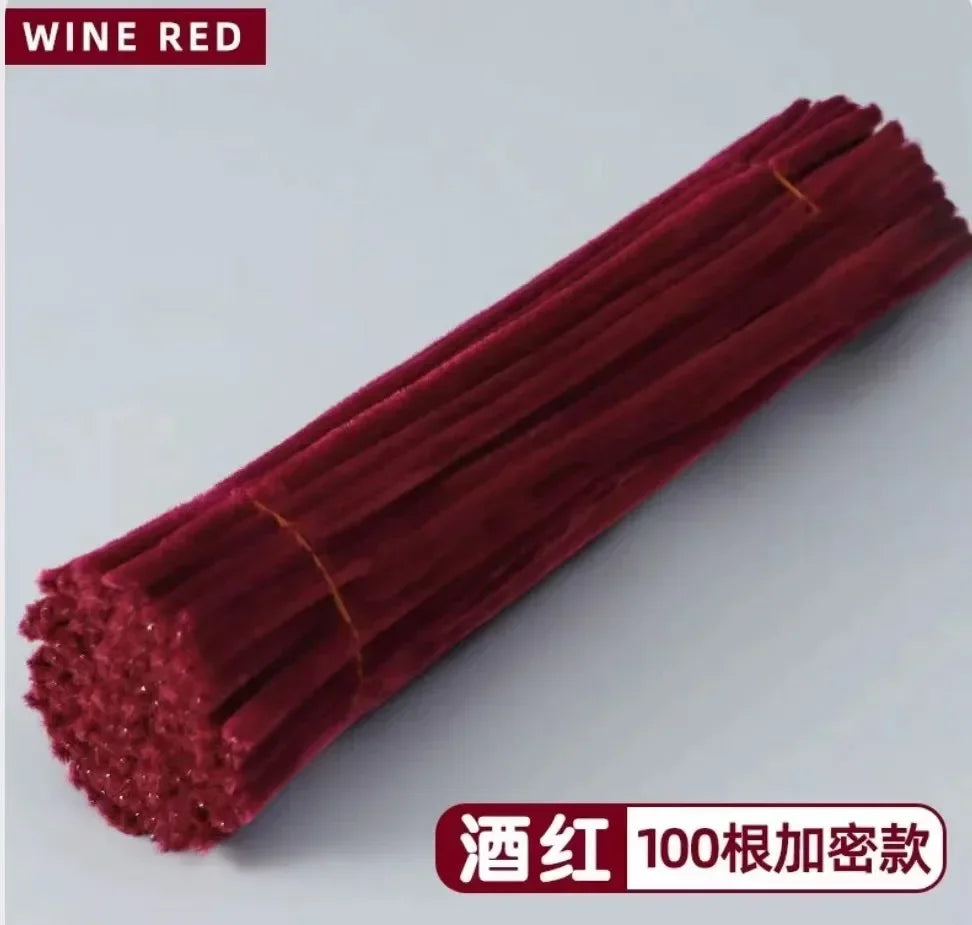 A bundle of deep red wine-colored chenille stems used for crafting.