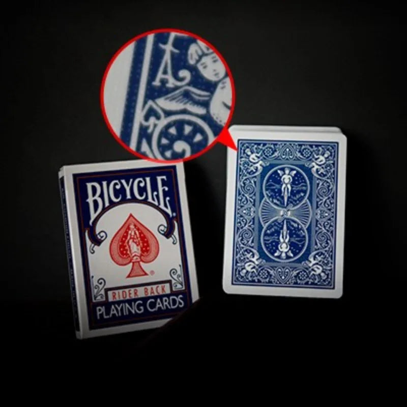 A blue and white Bicycle playing card featuring a rider back design with a red spade symbol.