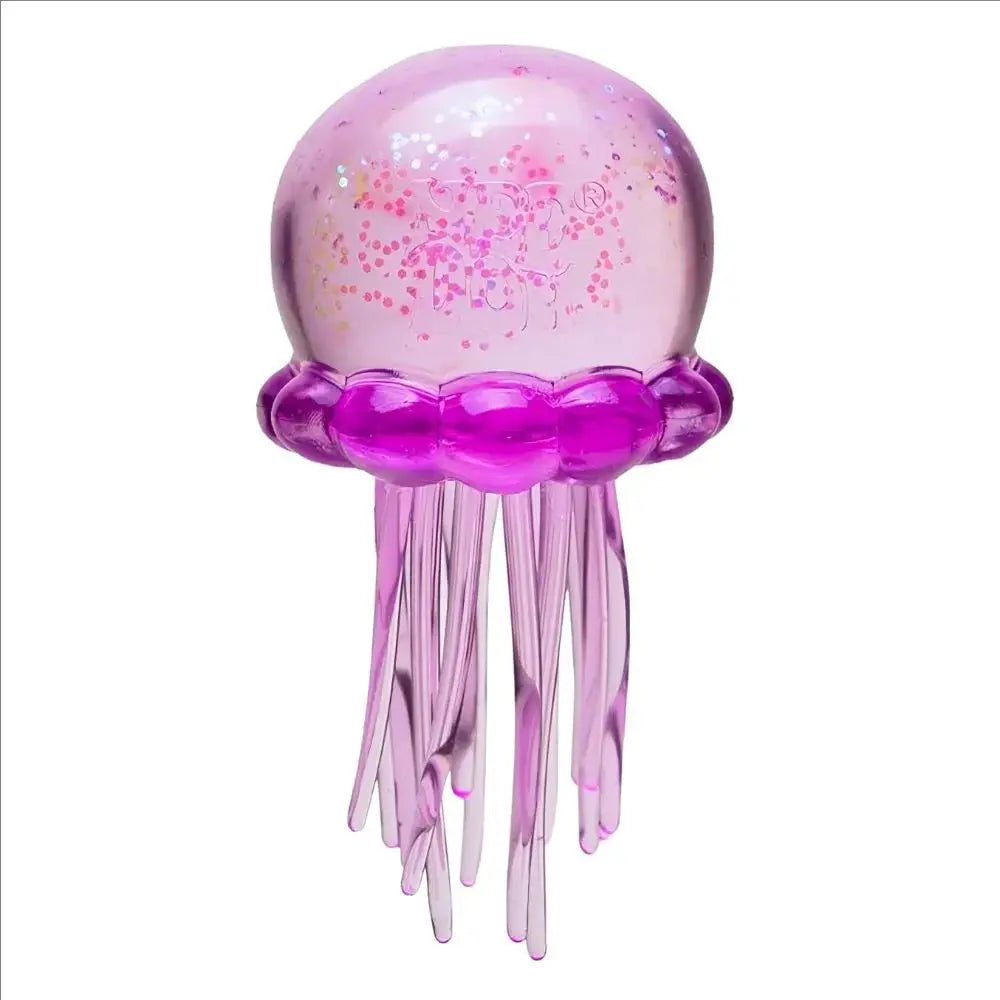 A translucent pink jellyfish squish toy with purple tentacles and glitter accents.