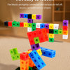 A colorful wooden stick and ring puzzle with various colored blocks is shown on a light surface.