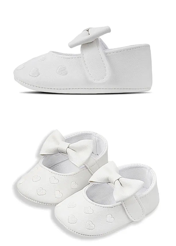 White baby girl shoes with a bow knot design and soft anti-slip sole