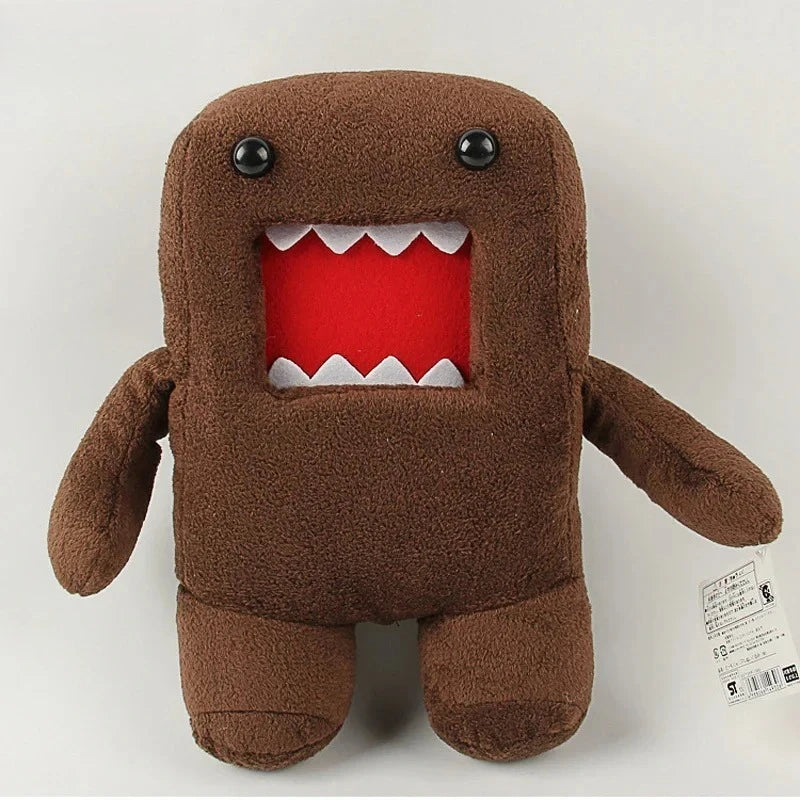 A brown plush toy shaped like a bear with an open mouth showing white teeth.