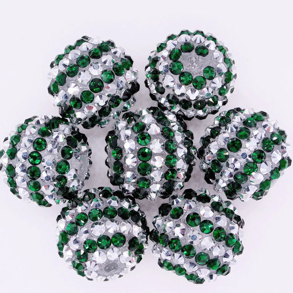 A cluster of ten green and silver mixed two-tone striped resin beads for jewelry making