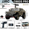 JJRC C8835 PRO off-road climbing vehicle with a machine gun accessory and remote control components