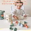 A toddler is playing with a set of wooden screws and matching toys for fine motor skills development.