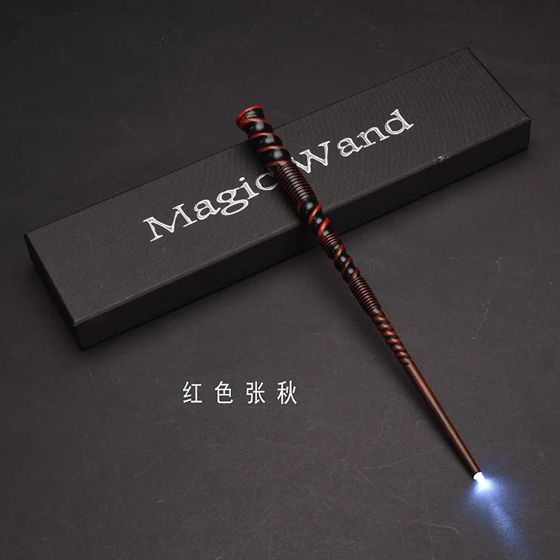 A red LED light-up magic wand is displayed diagonally on a dark surface with the text Magic Wand visible.