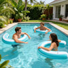 Three adults relax in a swimming pool using blue inflatable U-shaped floats.