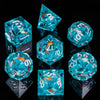 A collection of handmade liquid core resin dice in various shapes and colors, including blue and clear glass.