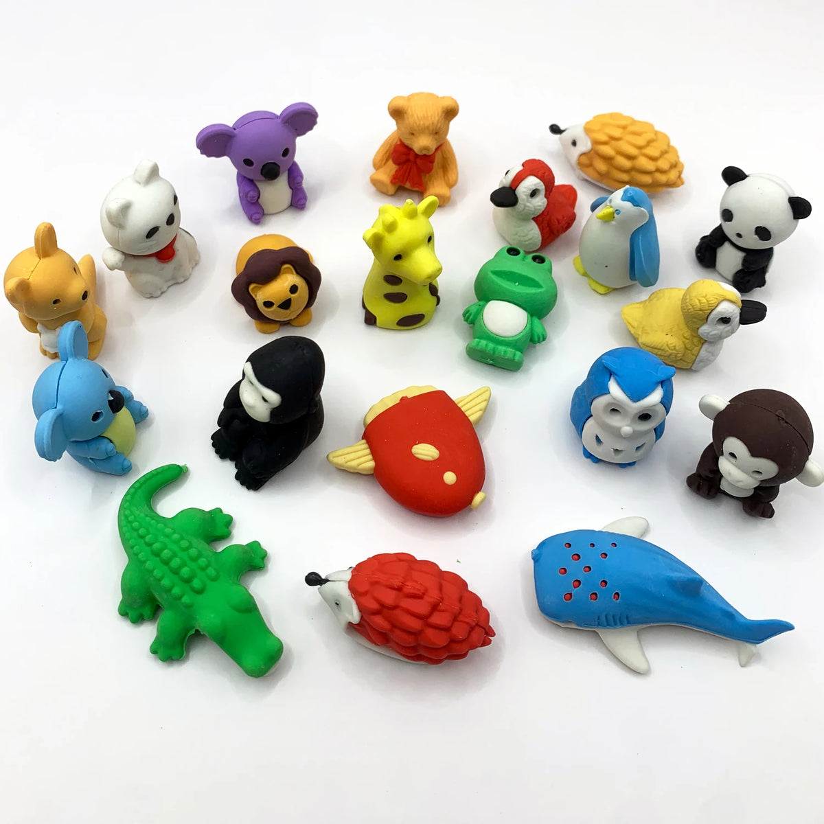 A collection of colorful 3D puzzle animal erasers for kids, including a purple elephant, yellow bear, and various other anima