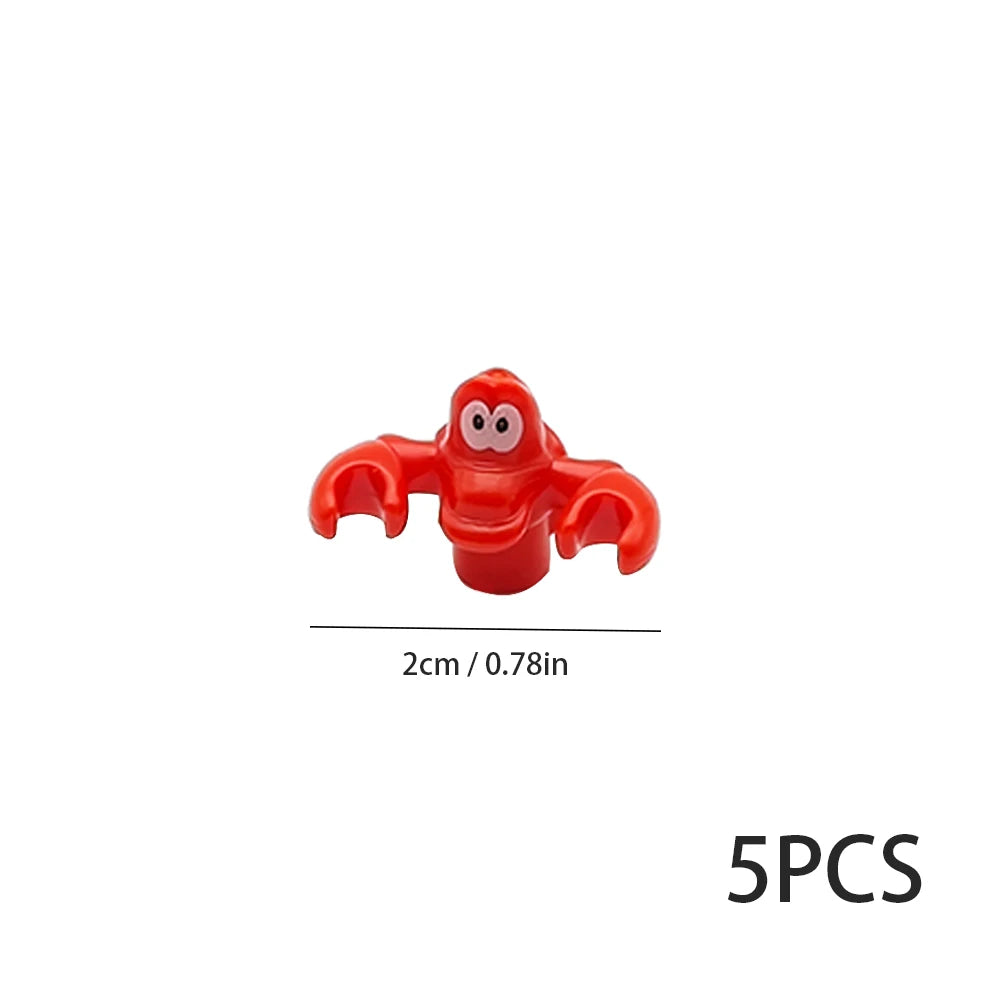 Five small, red, stylized marine creature building blocks.