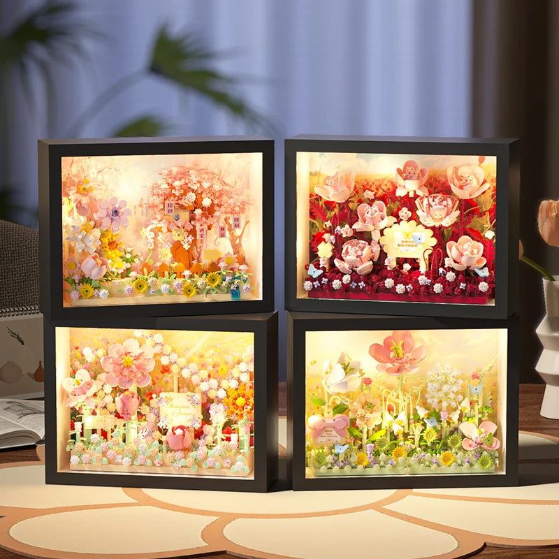 A set of three illuminated display boards featuring detailed 3D flower building blocks and craft kits for DIY projects.