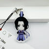 A clear acrylic pendant featuring a black-haired character in purple and blue attire attached to a metal keychain.