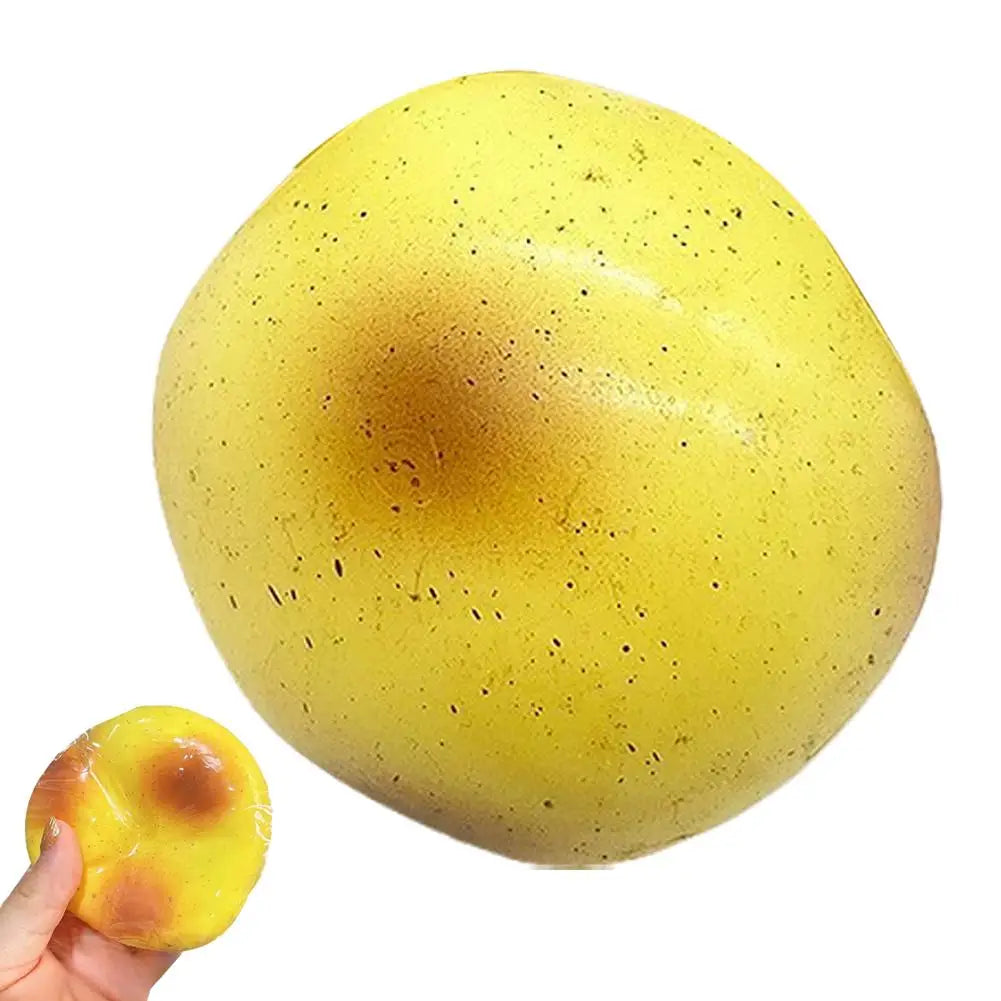 A yellow squishy butter stick fidget toy is shown being held, with a portion of the product showing a melted or warm spot.