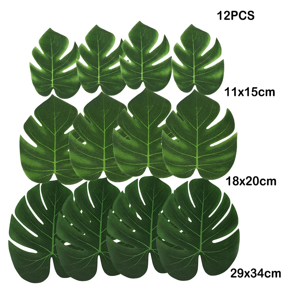 Twelve artificial tropical palm leaves in various sizes and shades of green for party decor