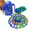 Colorful octopus desktop statue featuring blue, green, and purple tentacles and spherical heads