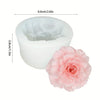 White silicone mold set for making flowers, including a large bloom and smaller petals.