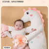 A white unicorn plush toy designed as a soothing pillow for babies, showing a warm area on the chest.